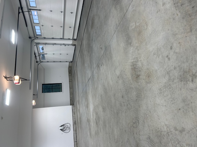 Before Garage Floor Coating - Cracked Concrete with Stains